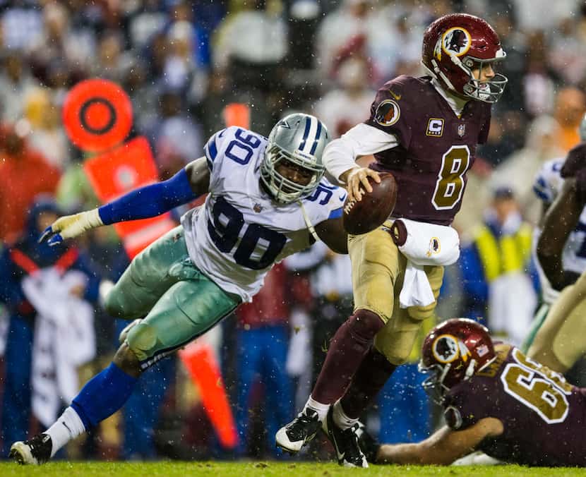 Dallas Cowboys defensive end Demarcus Lawrence (90) threatens Washington Redskins...