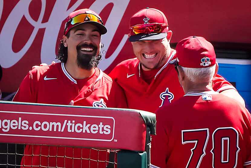 Los Angeles Angels third baseman Anthony Rendon (left) and center fielder Mike Trout laugh...