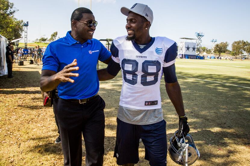 FILE - Dallas Cowboys wide receiver Dez Bryant (No. 88) chats with Cowboys great Michael...