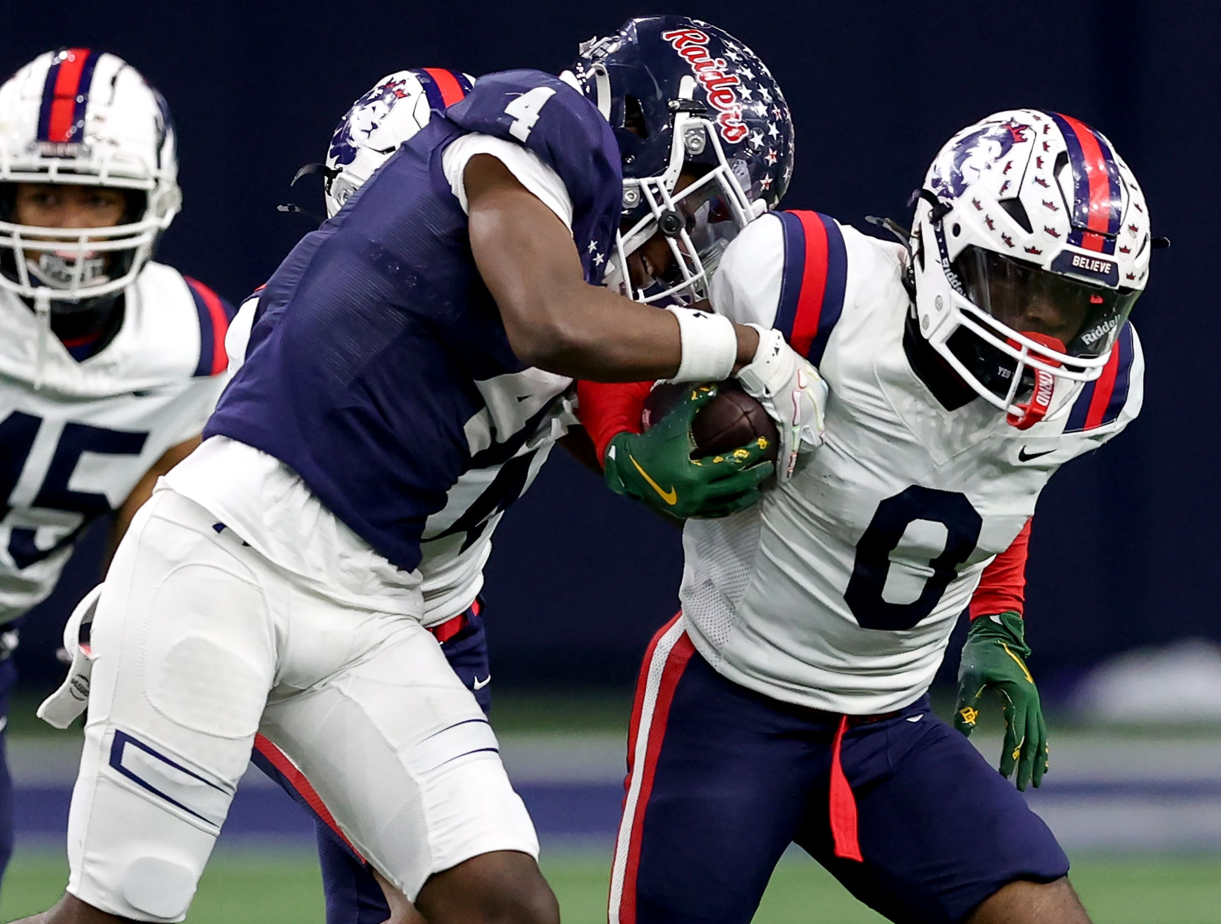 Richland kick returner Jaylen Gordon (0) fights off on a kick off Denton Ryan's Tre'Vaughn...