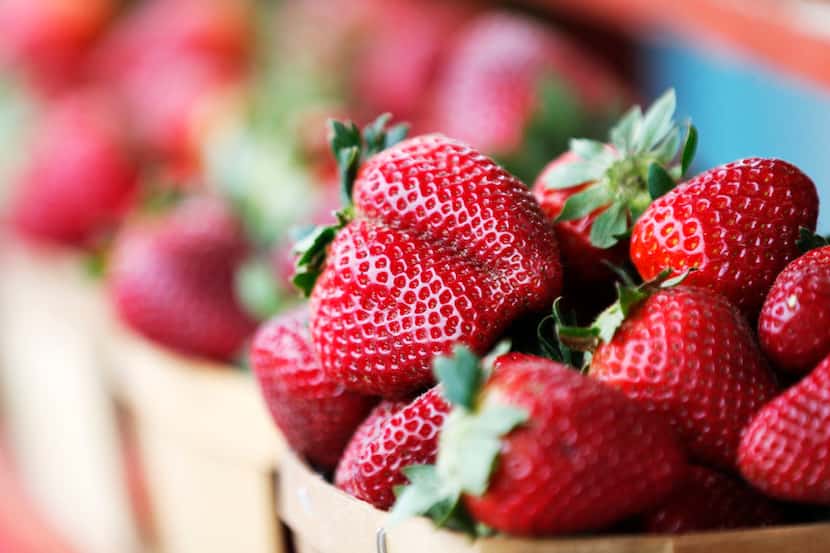 Strawberries from Highway 19 Produce & Berries are on display on opening day for the Tyler...