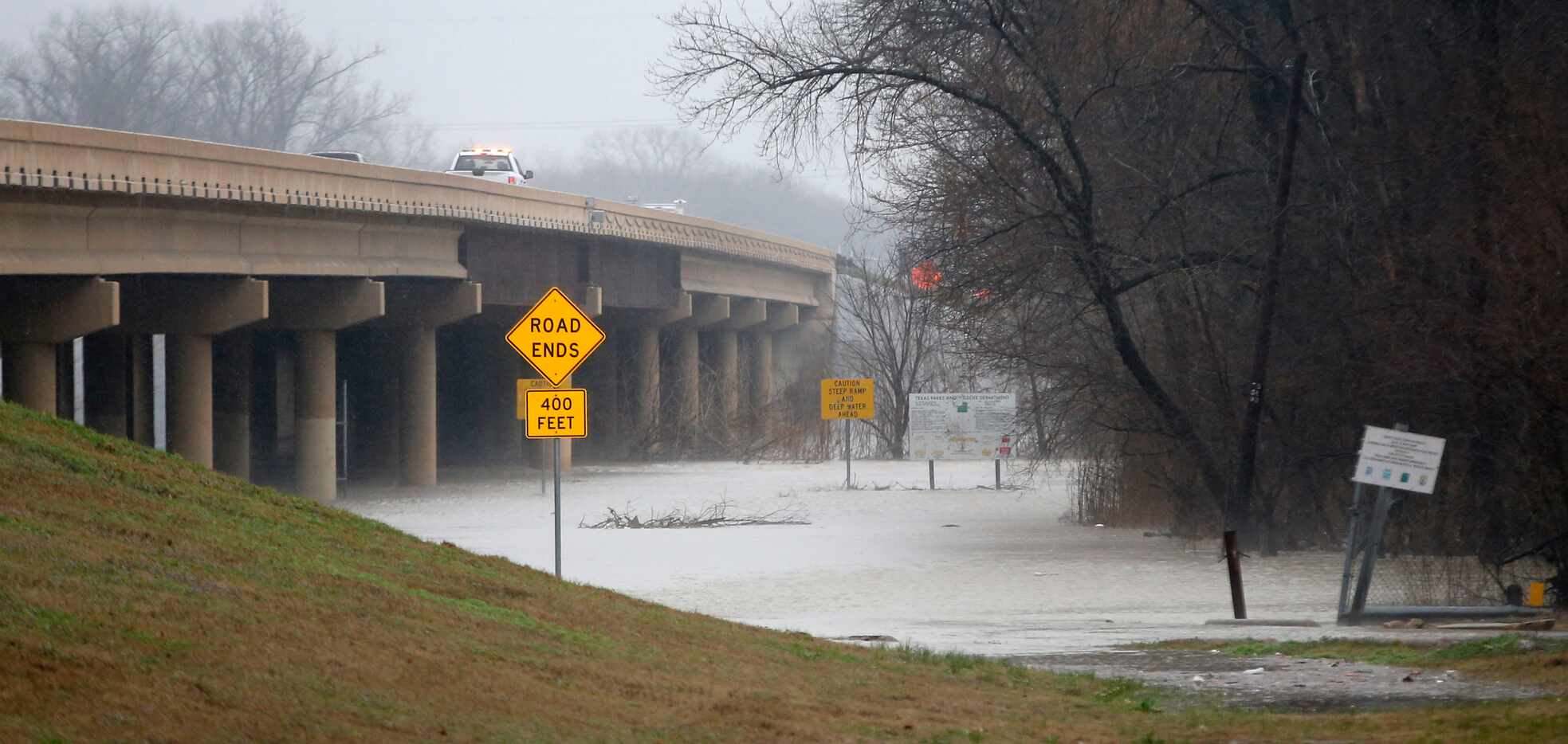 Dallas Fire-Rescue teams respond to a report that a car and person were swept away Wednesday.