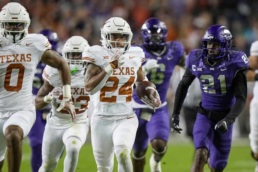 Texas running back Jonathon Brooks (24) runs for the first down against TCU in the first...