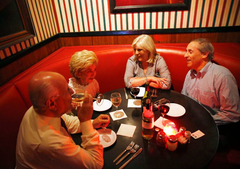 Vaughn Gross (second from left) shares a laugh with Tex Gross, Paige Flink and Randy Flink...