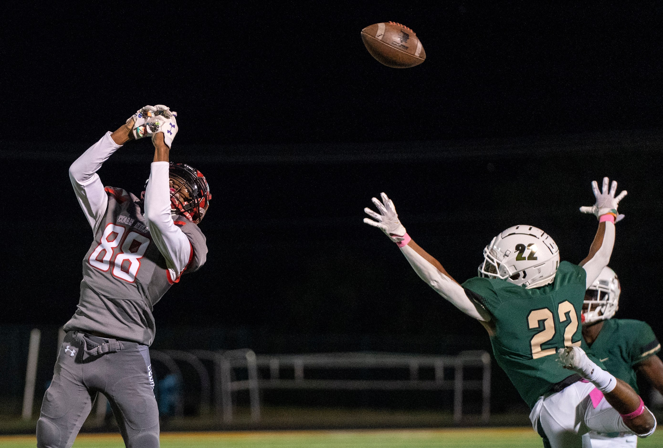 The ball slips through the fingers of Cedar Hill junior wide receiver Jairrus Nicholson (88)...