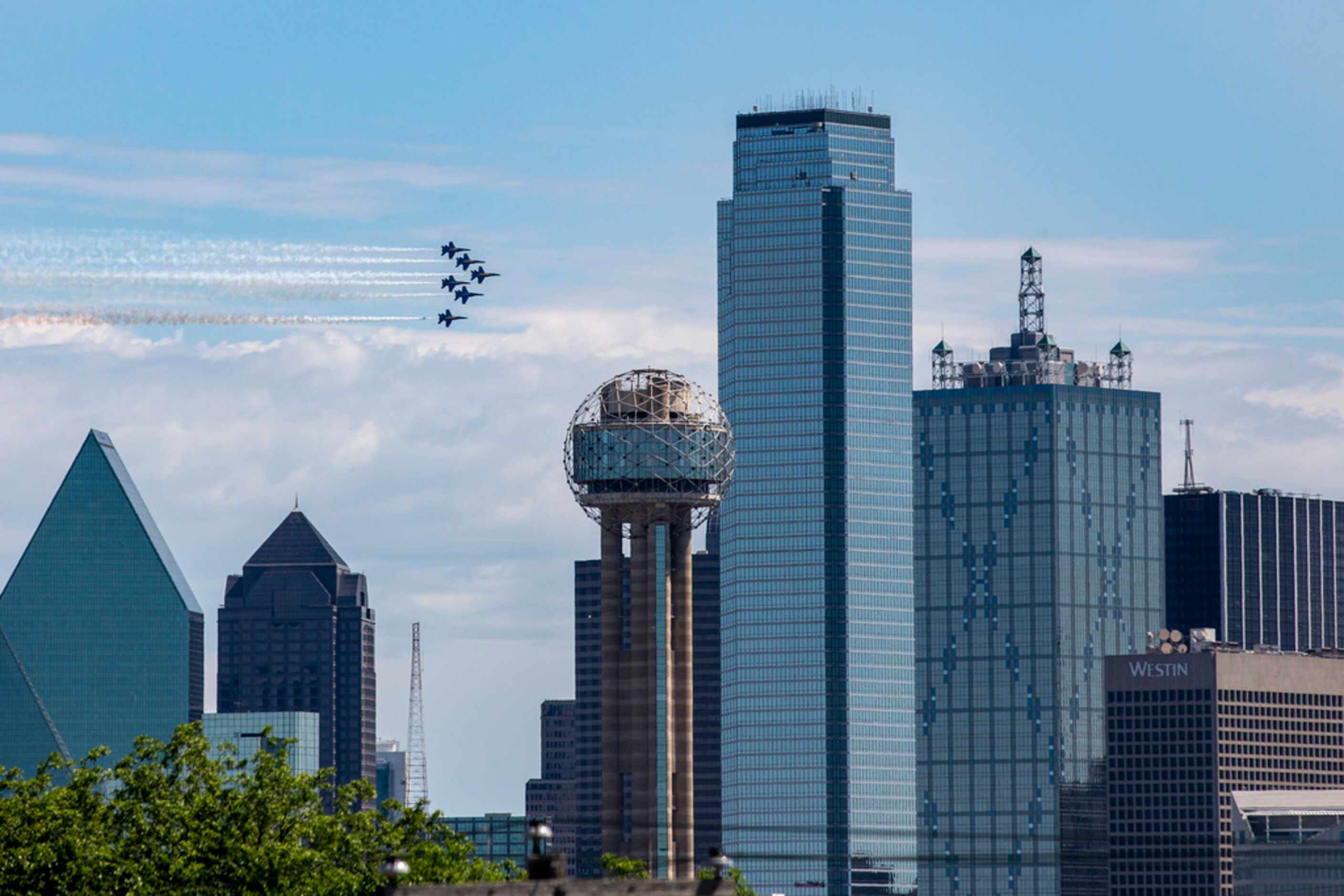 The U.S. Navy Blue Angels perform a flyover in Dallas on Wednesday, May 6, 2020.