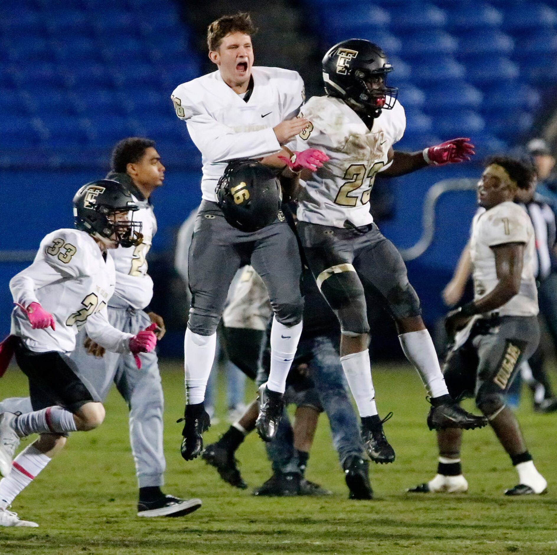 The Colony High School punter Nick Young (16) leaps in celebration with The Colony High...