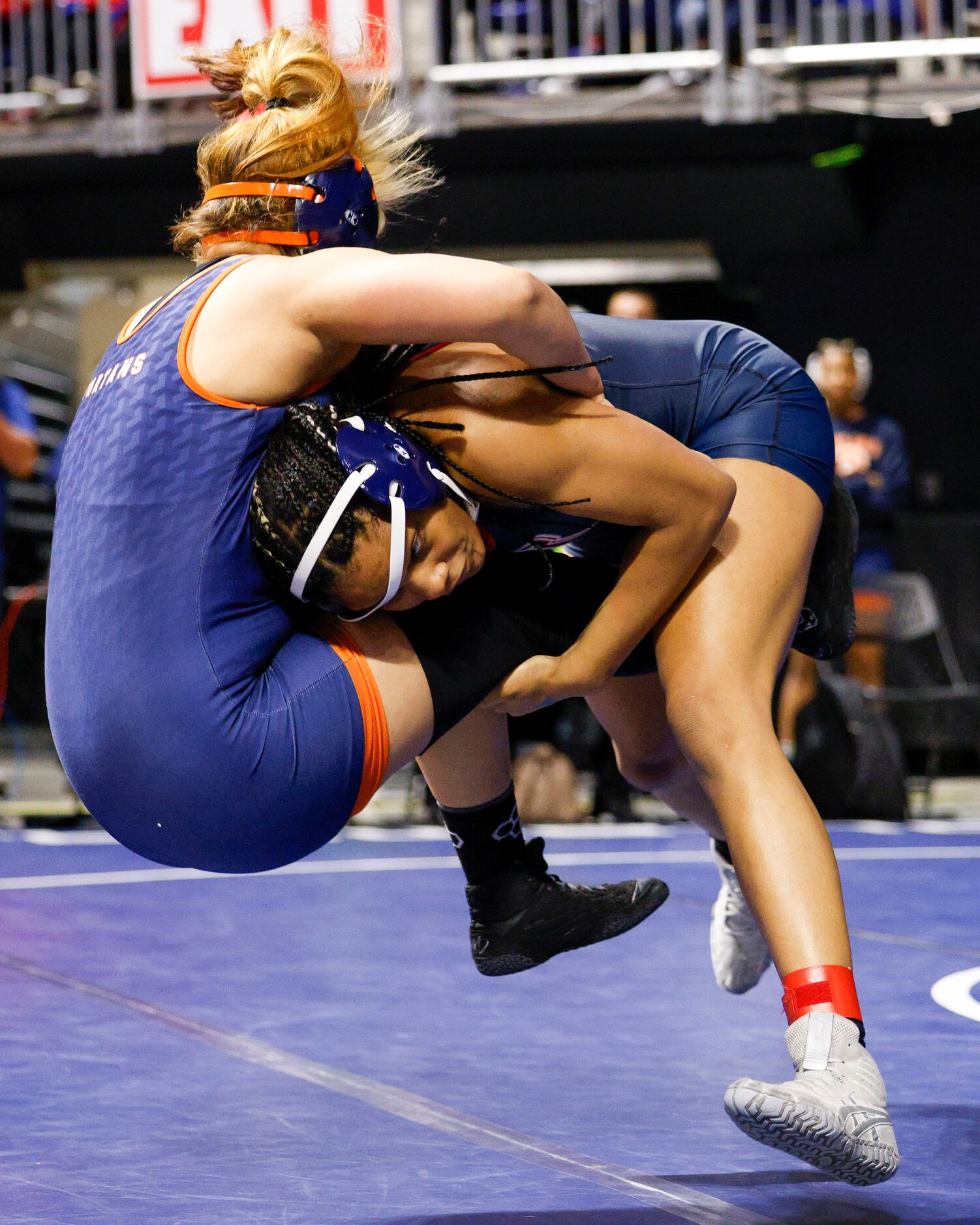 Jasmine Robinson of Allen (right) takes down Nina Amico of Katy Seven Lakes during a...