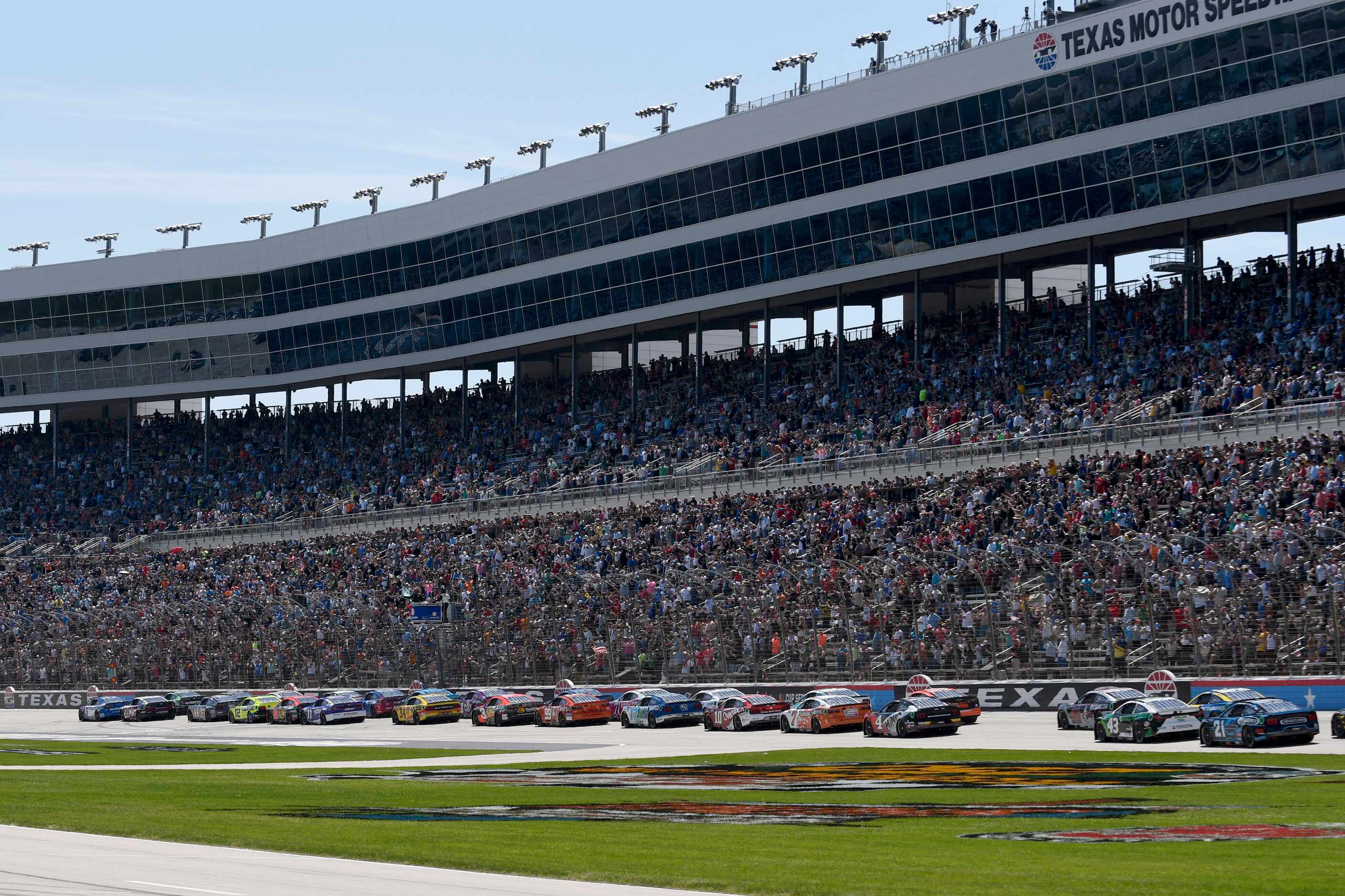 The field takes the green flag for the start of a NASCAR Cup Series auto race at Texas Motor...