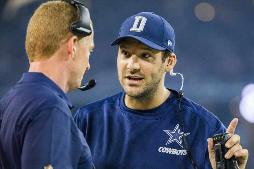 Injured Dallas Cowboys quarterback Tony Romo (9) talks to Dallas Cowboys head coach Jason...