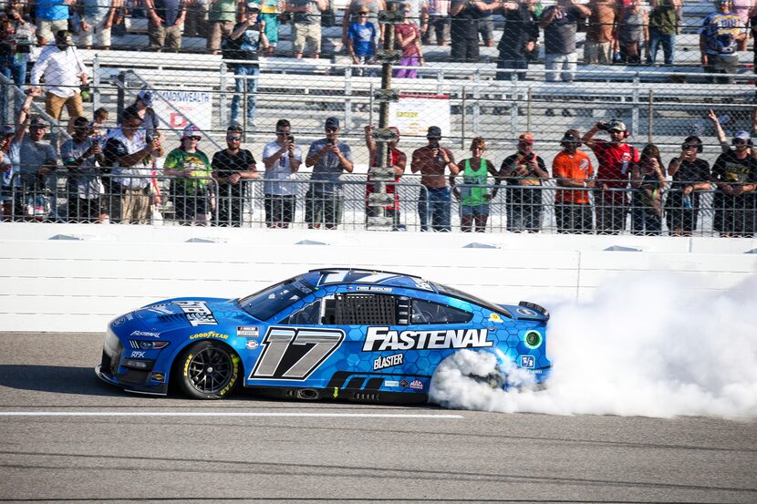 Chris Buescher does a burnout after winning a NASCAR Cup Series auto race, Sunday, July 30,...