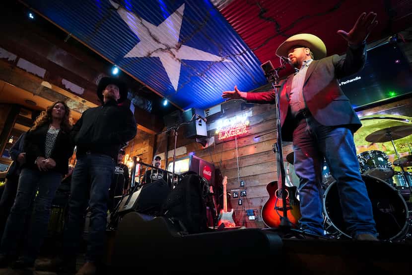 Lee Wells acknowledges volunteers during a benefit concert at Sideways BBQ on Monday, March...