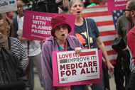 Demonstrators gather near Trump Tower to celebrate the defeat of President Donald Trump's...