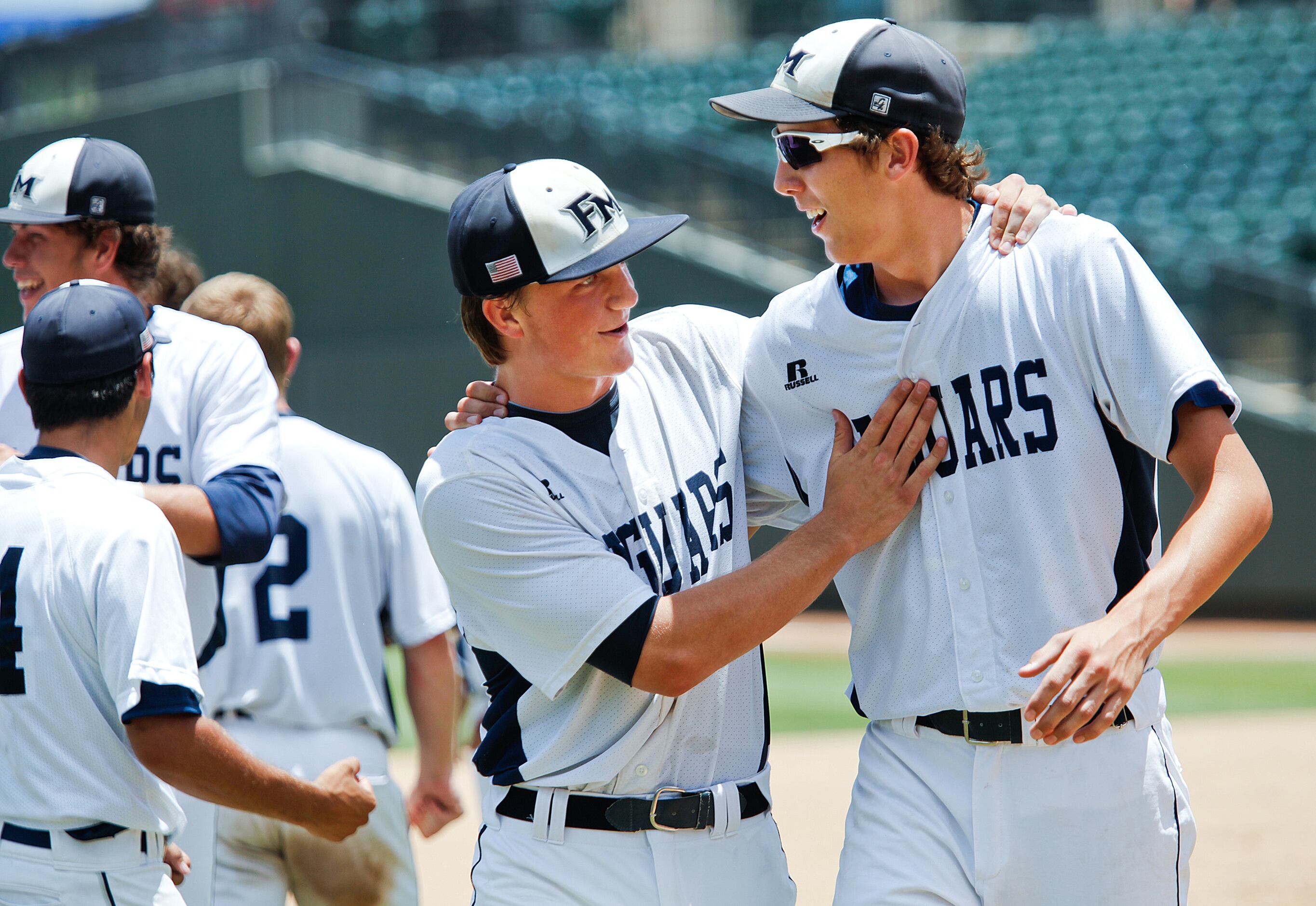 Flower Mound player Casey Jacobsen (13, left) and Parker Murphy (6) celebrate after their...
