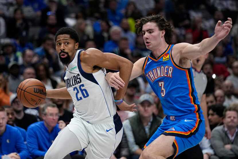 Dallas Mavericks guard Spencer Dinwiddie (26) works to get past Oklahoma City Thunder guard...