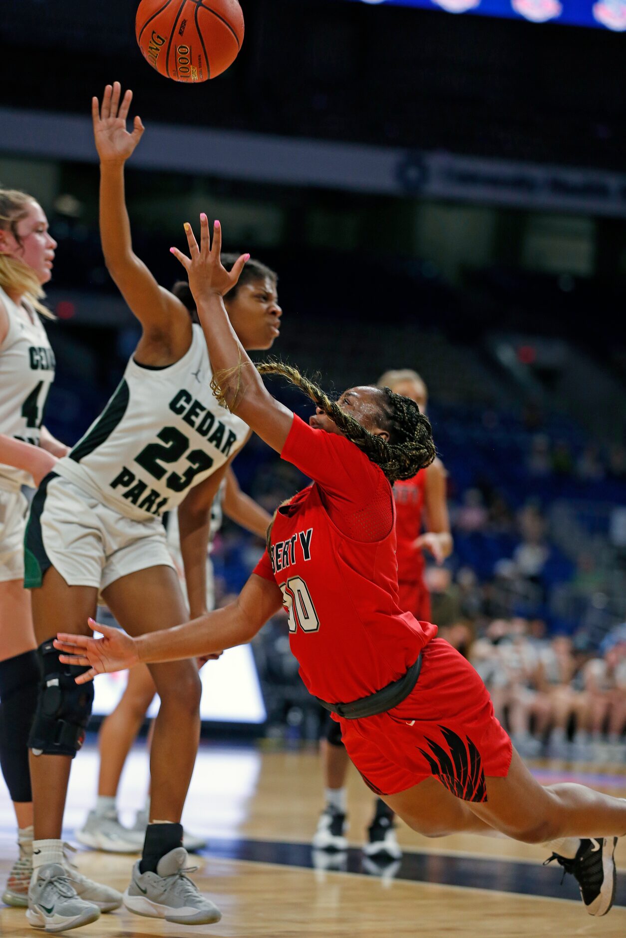 Frisco Liberty Jazzy Owens-Barnett #30 drives on Cedar Park Alisa Knight #23. Frisco Liberty...