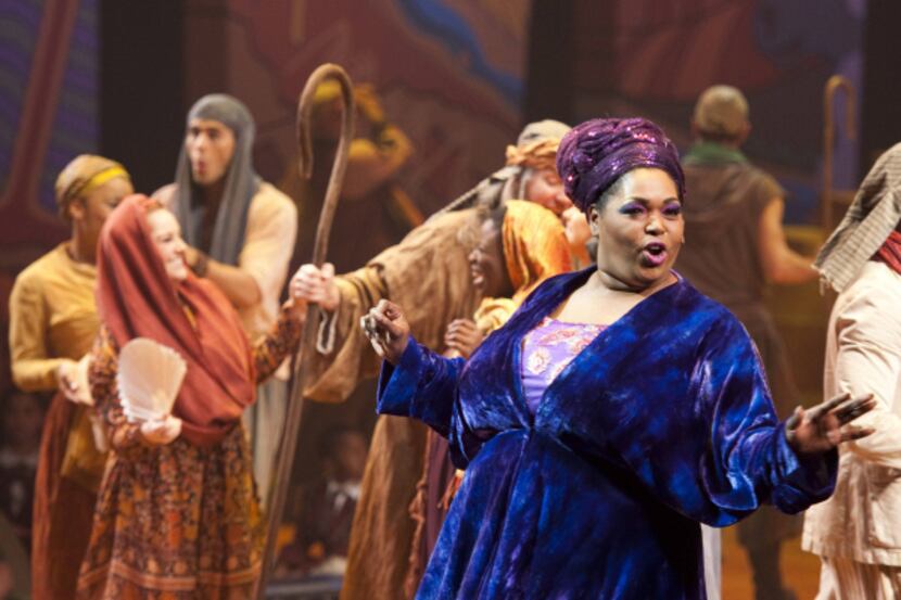 Narrator (Liz Mikel) sings "Jacob and Sons," the story of Joseph through, during Dallas...