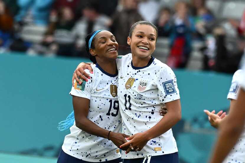 United States' Sophia Smith, right, celebrates with United States' Crystal Dunn after...