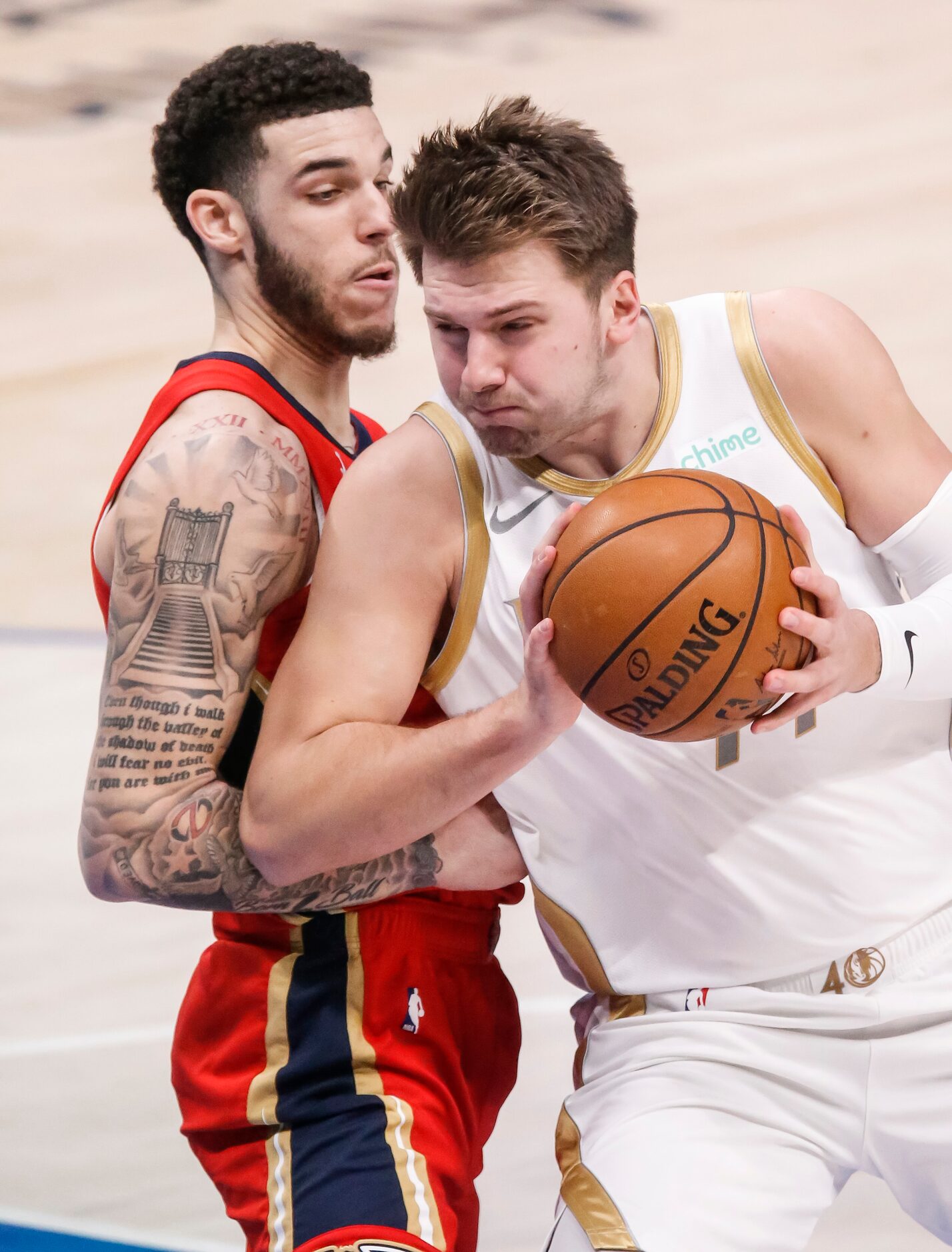 Dallas Mavericks guard Luka Doncic (77) battles New Orleans Pelicans guard Lonzo Ball (2)...