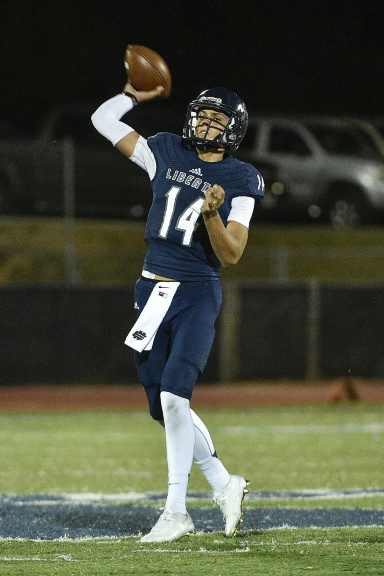 Liberty quarterback Nick Starkel (14) throws a touchdown pass in the first quarter of...