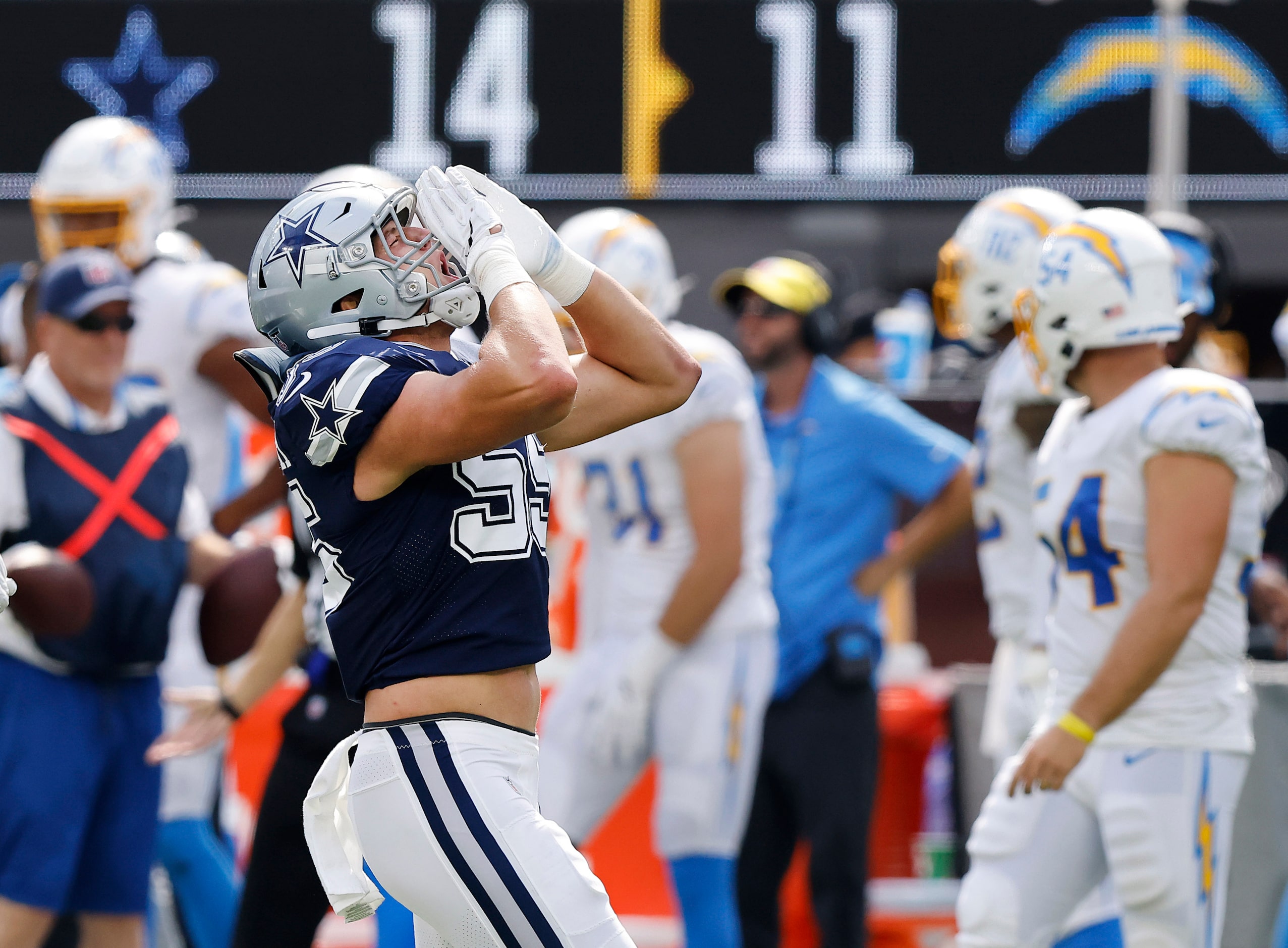 Dallas Cowboys linebacker Leighton Vander Esch (55) lets loose the wolf howl after sacking...