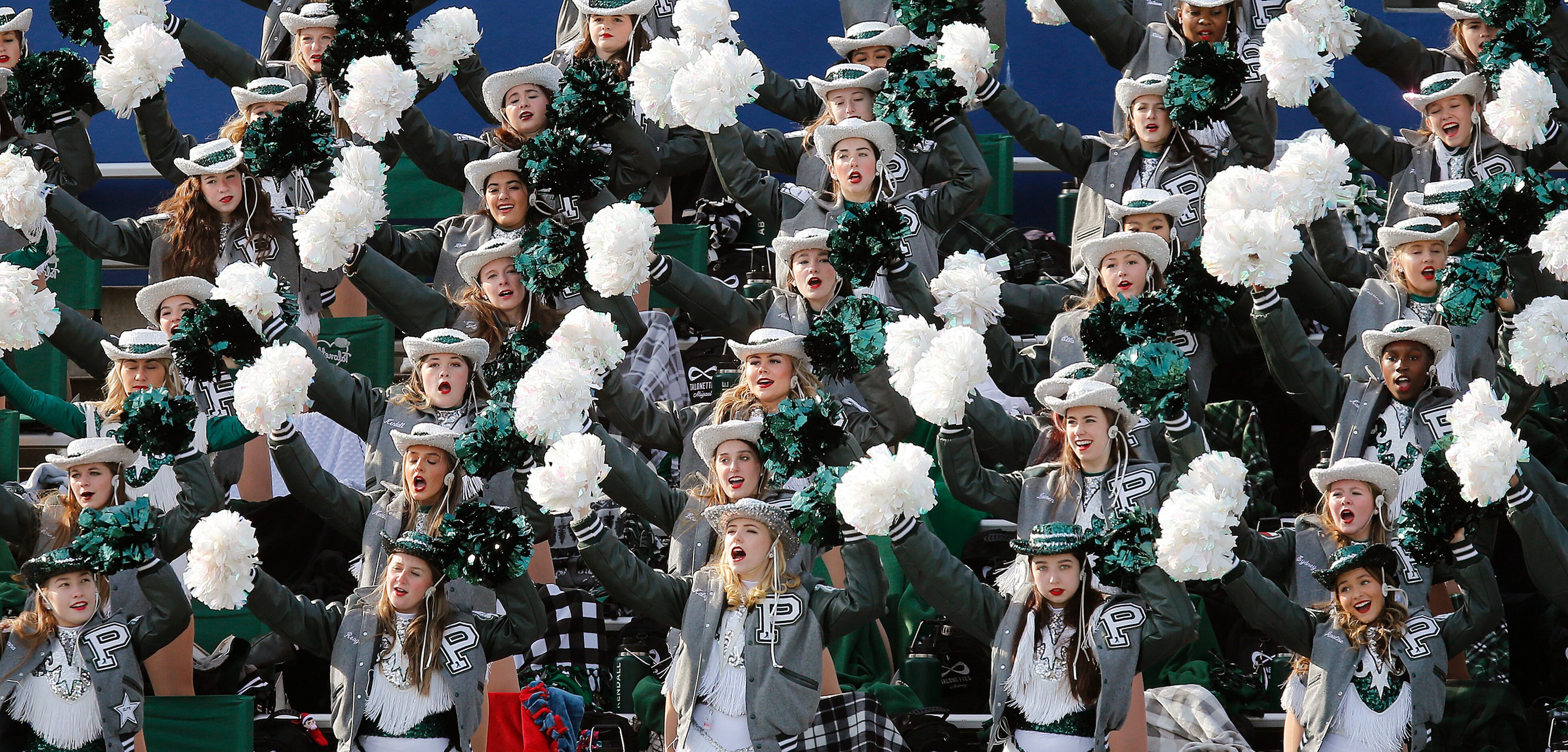 The Prosper High School drill team cheers their team during the first half as Prosper High...