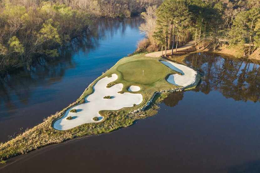 An aerial view of No. 15 at Whispering Pines Golf Club in Trinity, Texas, is a 179-yard...