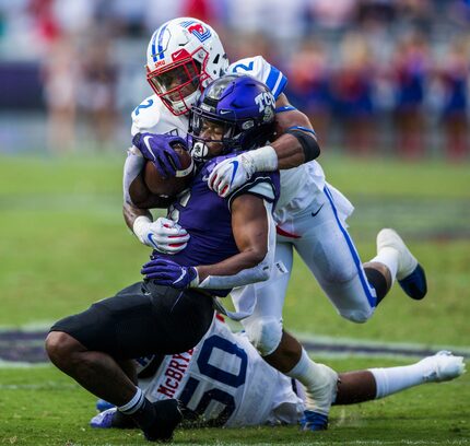 TCU Horned Frogs running back Darius Anderson (6) is tackled by Southern Methodist Mustangs...