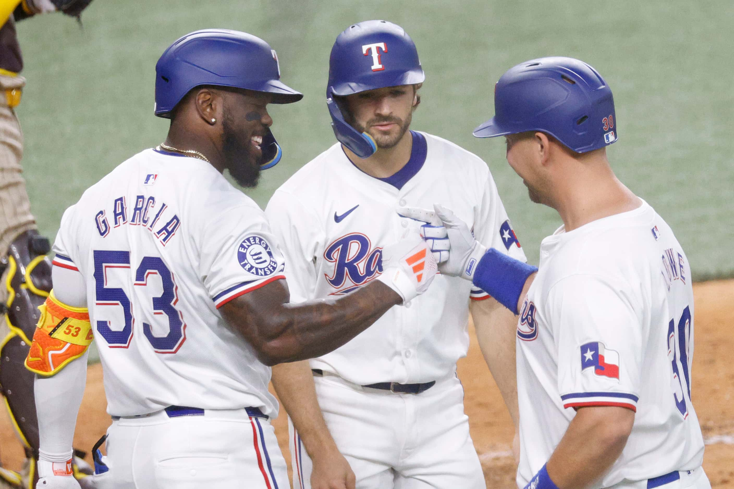 Texas Rangers first base Nathaniel Lowe (30), right, celebrates after hitting a home run...