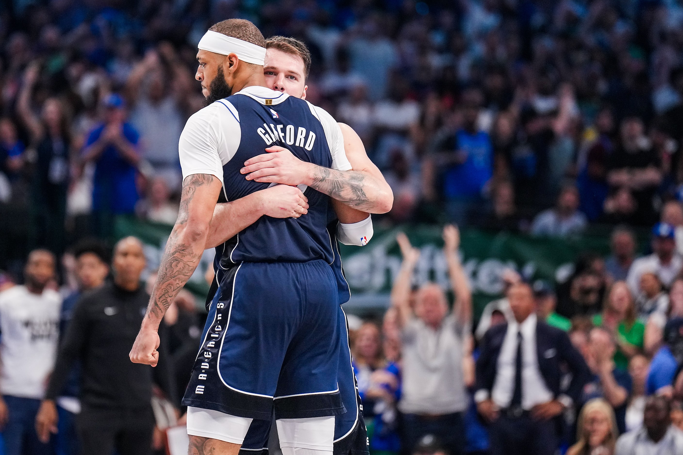 Dallas Mavericks guard Luka Doncic hugs center Daniel Gafford during the second half in Game...