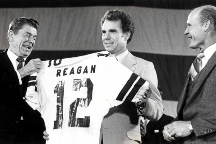 From the early 1980s, President Ronald Reagan (left) accepts a jersey from Roger Staubach...