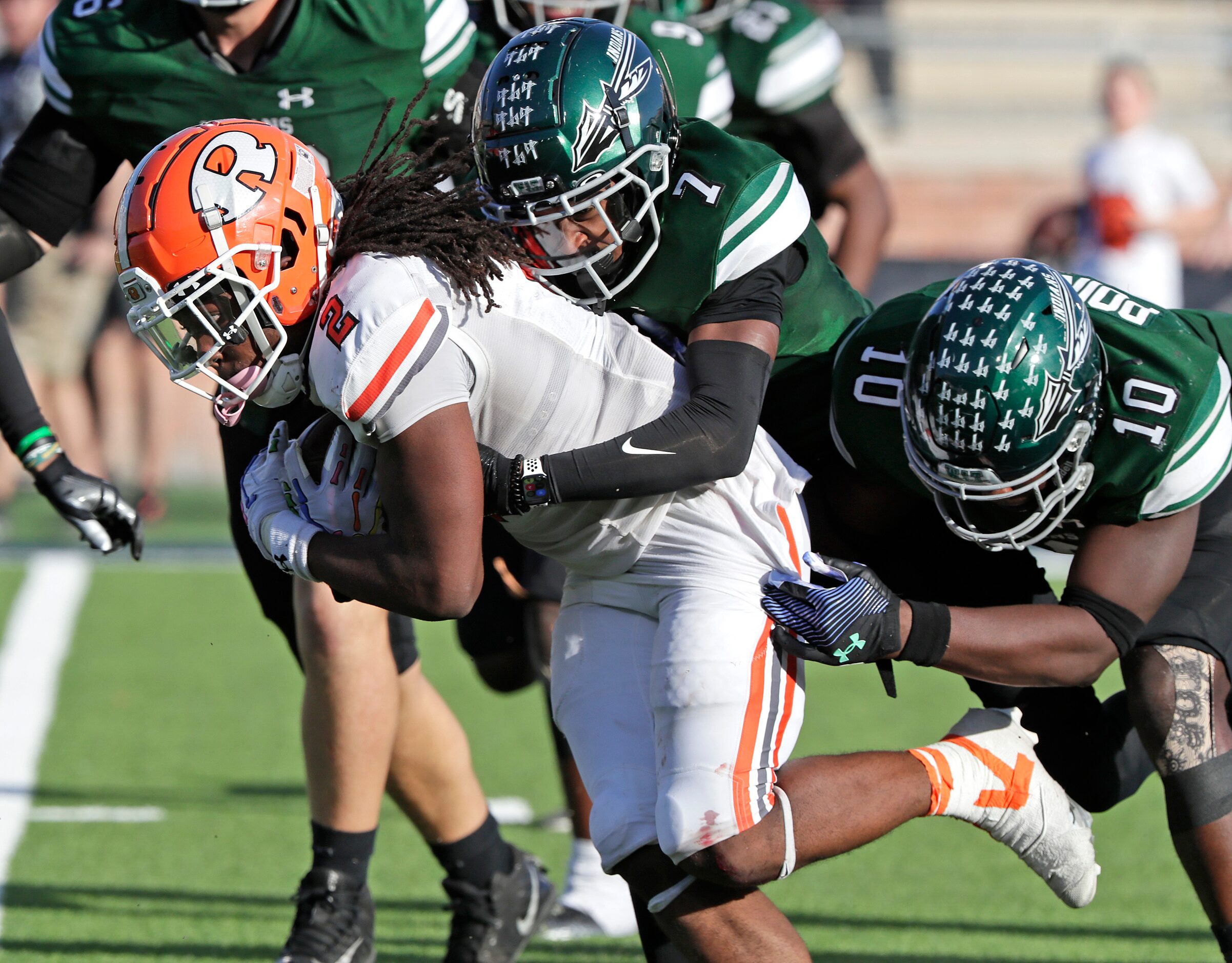 Rockwall High School running back Ashten Emory (2) gets a crucial first down as Waxahachie...