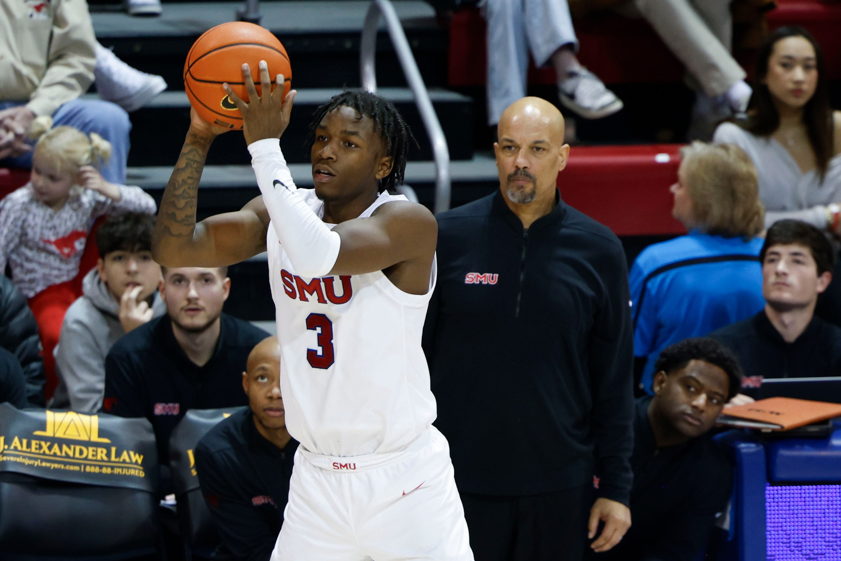 Southern Methodist guard Chuck Harris (3) looks to pass the ball as Southern Methodist  head...