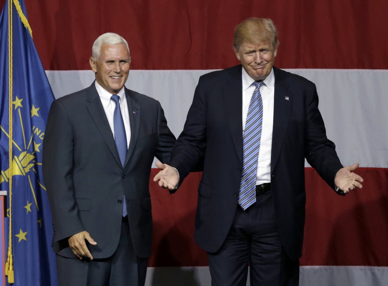 Indiana Gov. Mike Pence joins Republican presidential candidate Donald Trump at a rally in...
