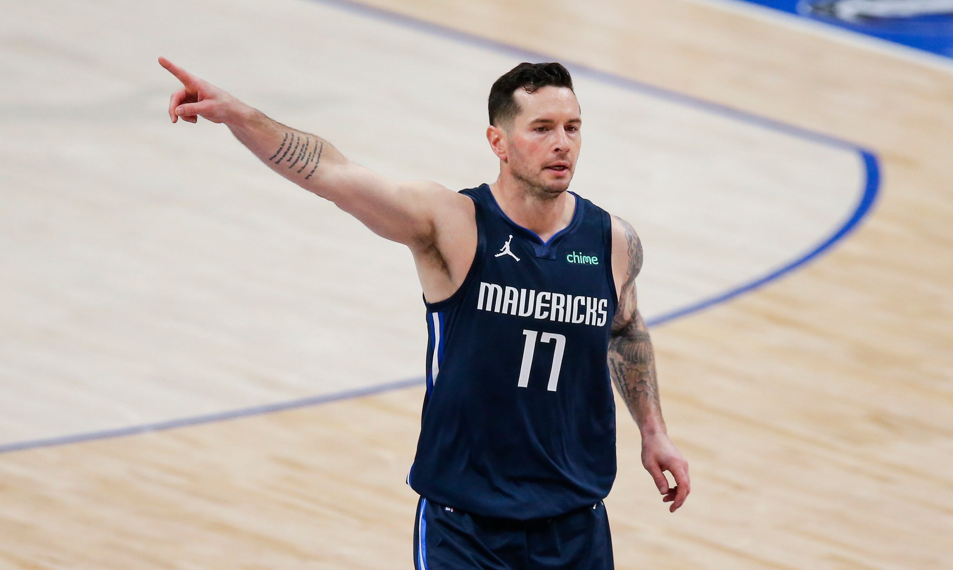 Dallas Mavericks guard JJ Redick (17) directs his teammates during the first half of an NBA...