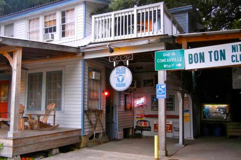 
The Blue Moon Saloon & Guest House appears peaceful in the daytime on a quiet street in...