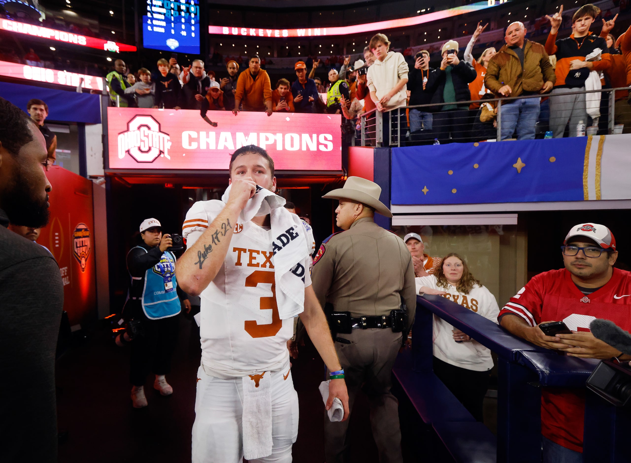 As he headed to the locker room, Texas Longhorns quarterback Quinn Ewers (3) turned back for...