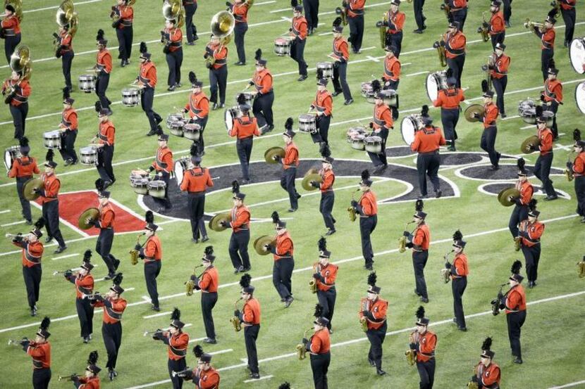 The Cincinnati Bearcats marching band performs before the first half of an NCAA college...