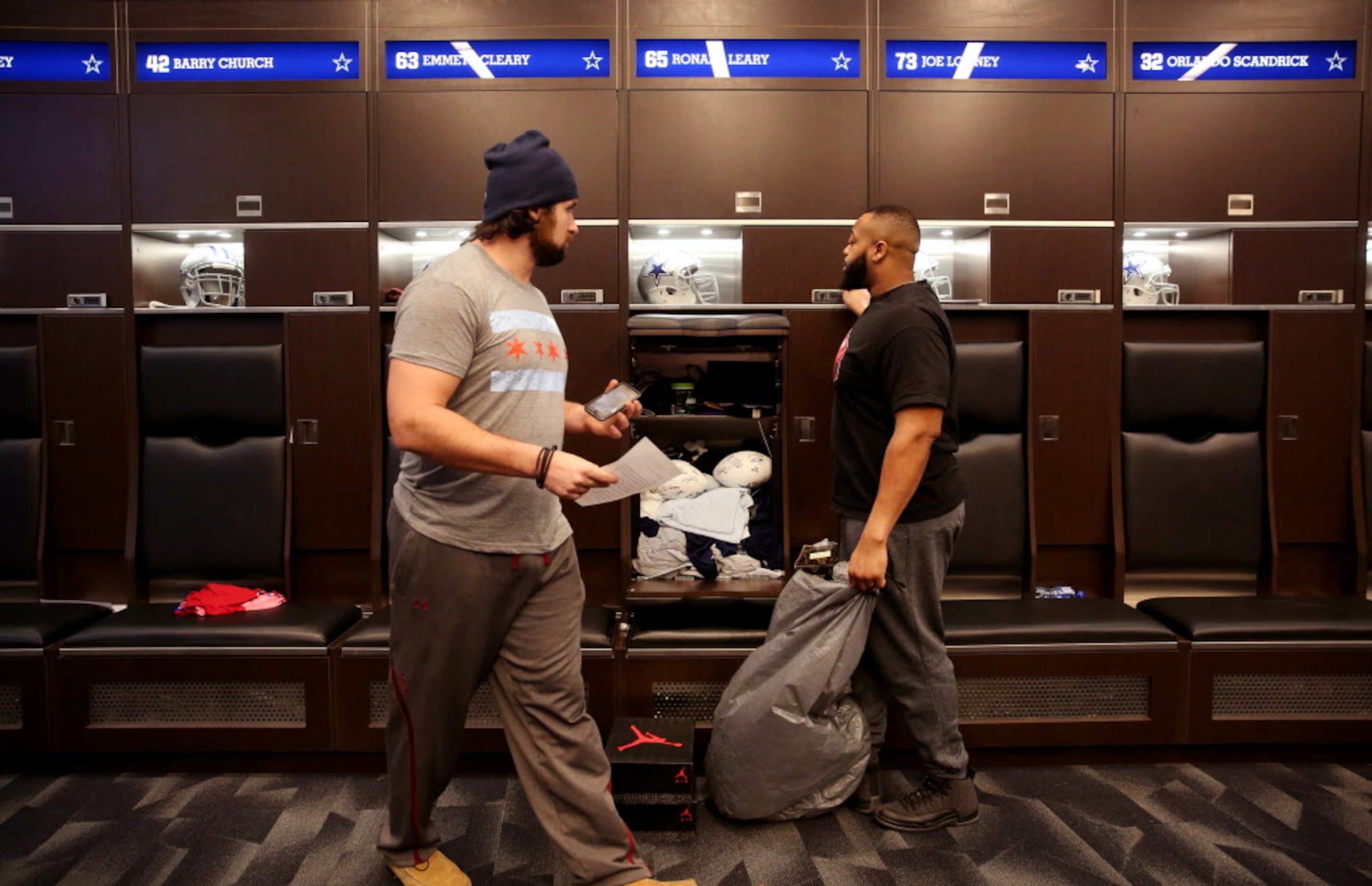 Dallas Cowboys guard Ronald Leary (right) cleans out his locker alongside guard Emmett...