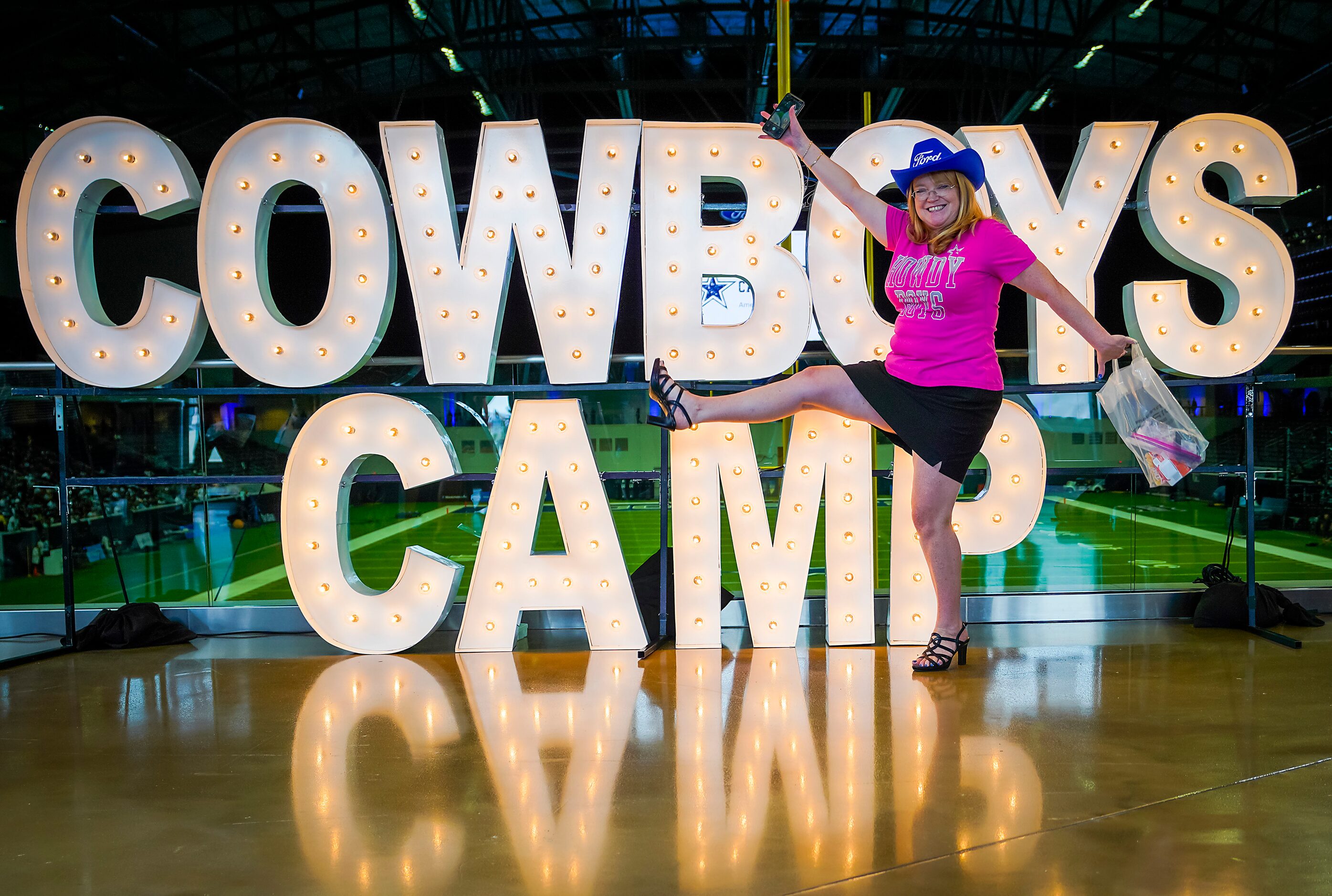 Ann-Marie Jankowski, of Waxahachie, Texas, has her photo taken as she arrives at the stadium...