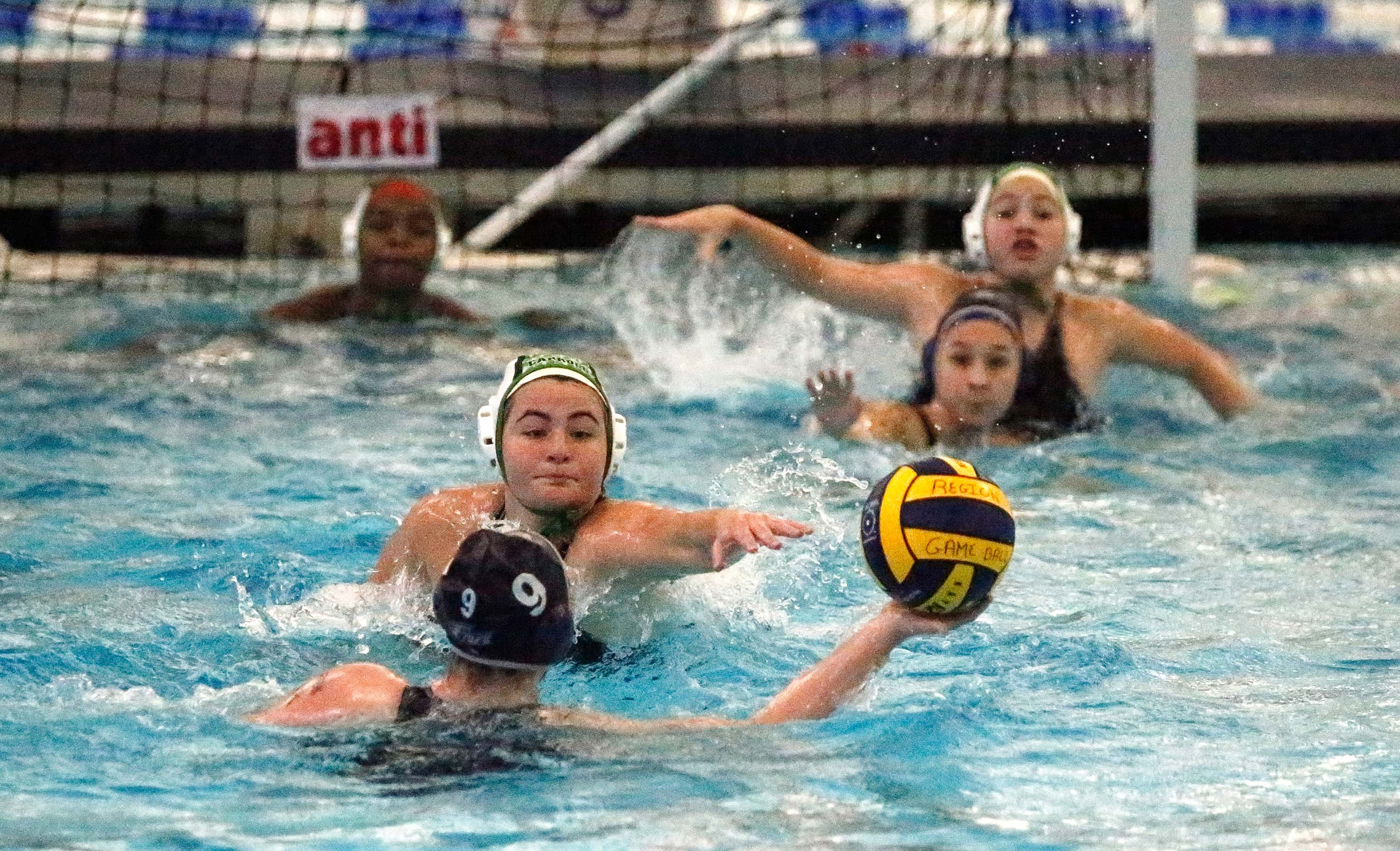 Southlake’s JoJo Walters (15) prevents Flower Mound’s Kaylee Pfister (9) froma taking a shot...