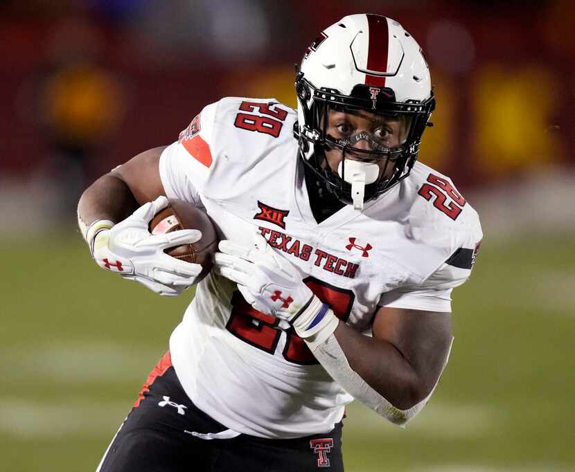 FILE - Texas Tech running back Tahj Brooks carries the ball upfield during the second half...