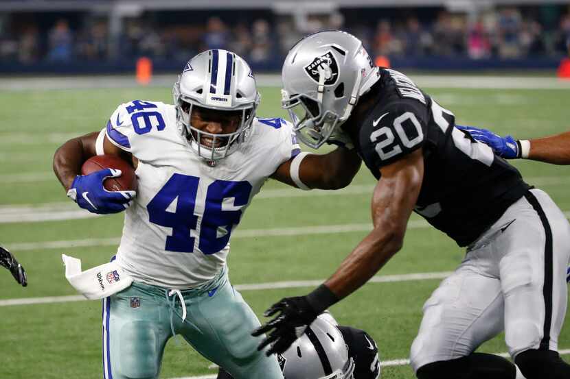 Dallas Cowboys' Alfred Morris (46) is tackled after a run by Oakland Raiders safety Obi...