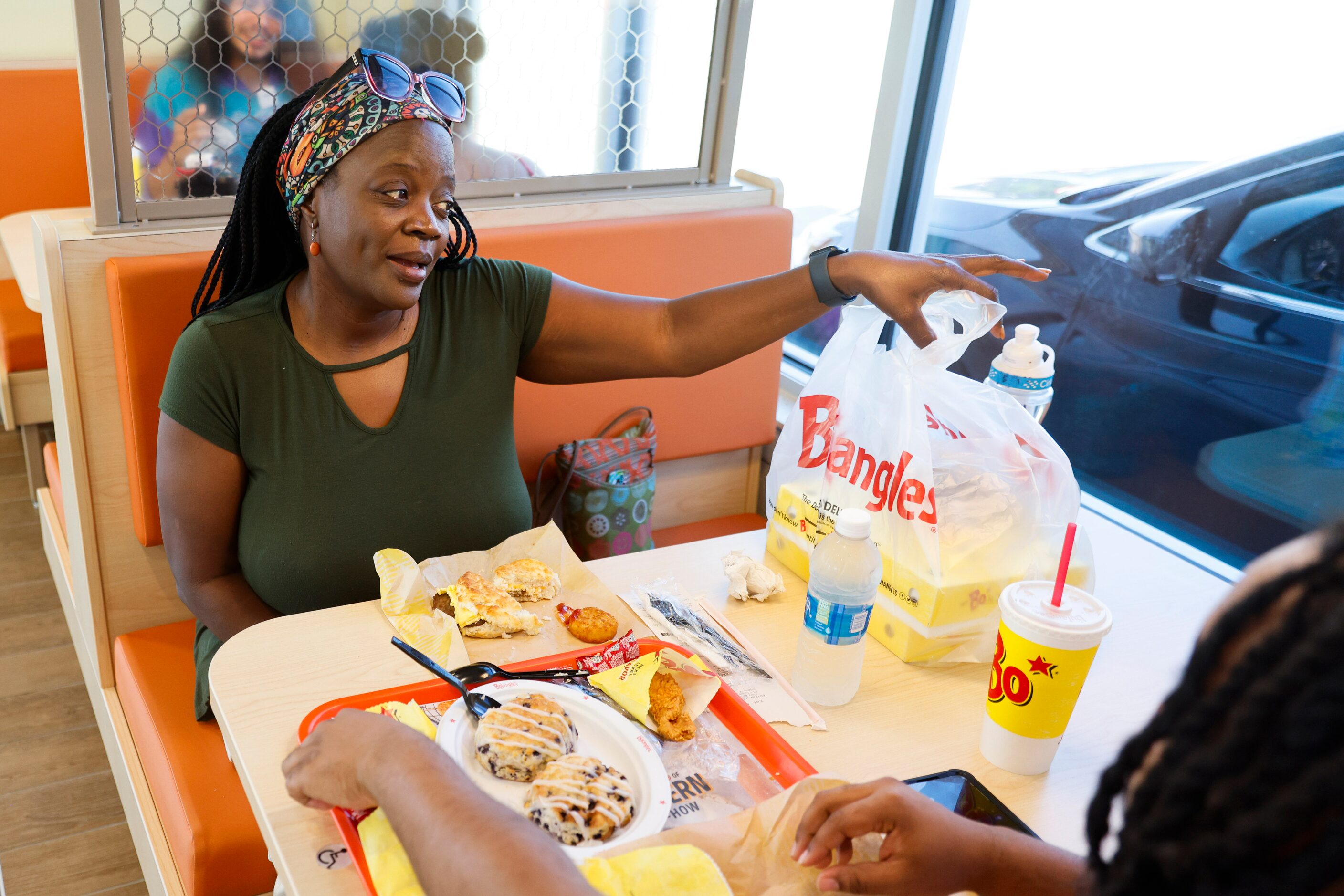 Yvonne Beacham reacts towards her free birthday meal during the opening day of Bojangles in...