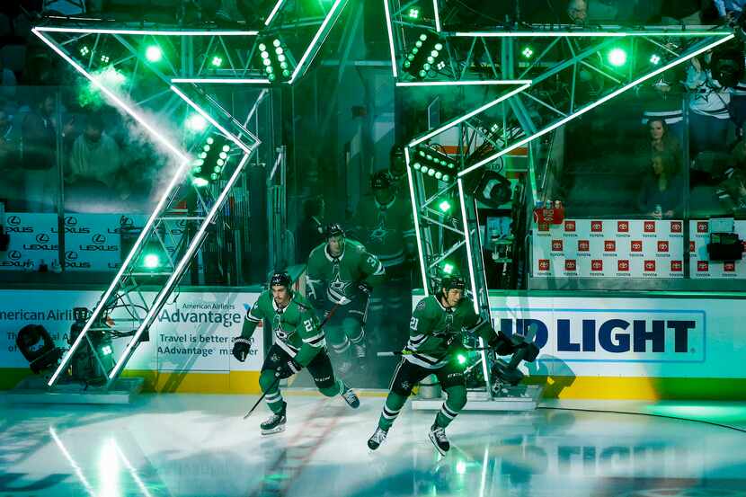 Dallas Stars left wing Jason Robertson (21) and left wing Mason Marchment (27) take the ice...
