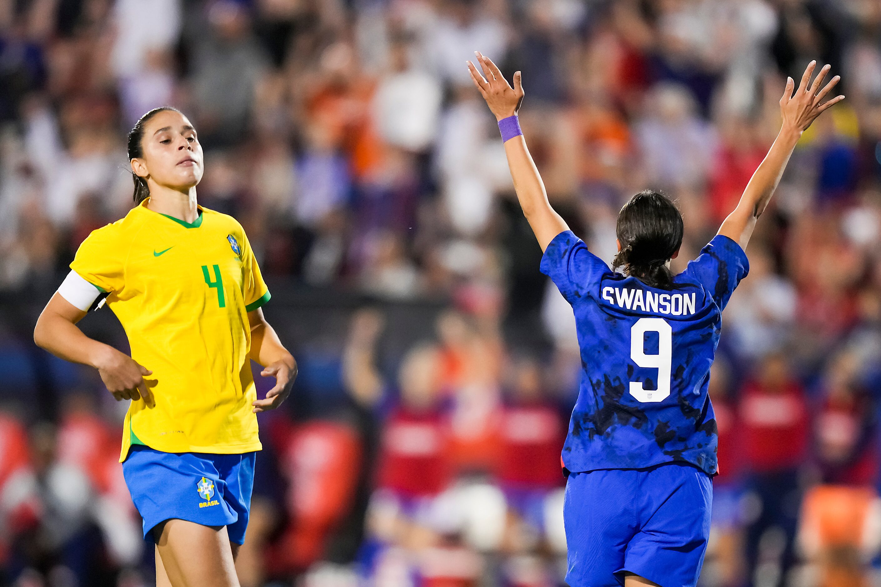 United States forward Mallory Swanson (9) celebrates past Brazil defender Rafaelle (4) after...