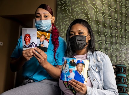 Cousins Nicole Hill (left) and Netia Smith hold photos of deceased brothers Isaac (second...