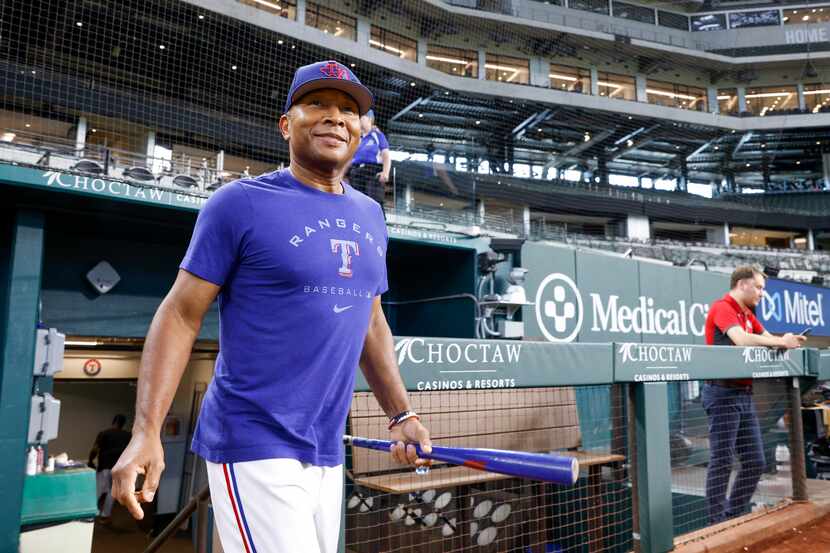 Texas Rangers interim manager Tony Beasley takes the field for batting practice before a...