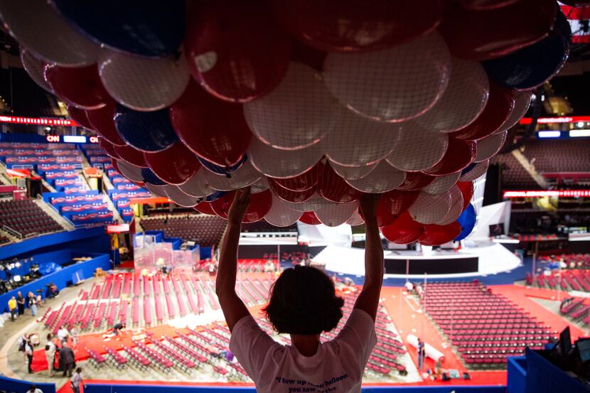 Workers prepare for a balloon drop for the Republican National Convention, at the Quicken...