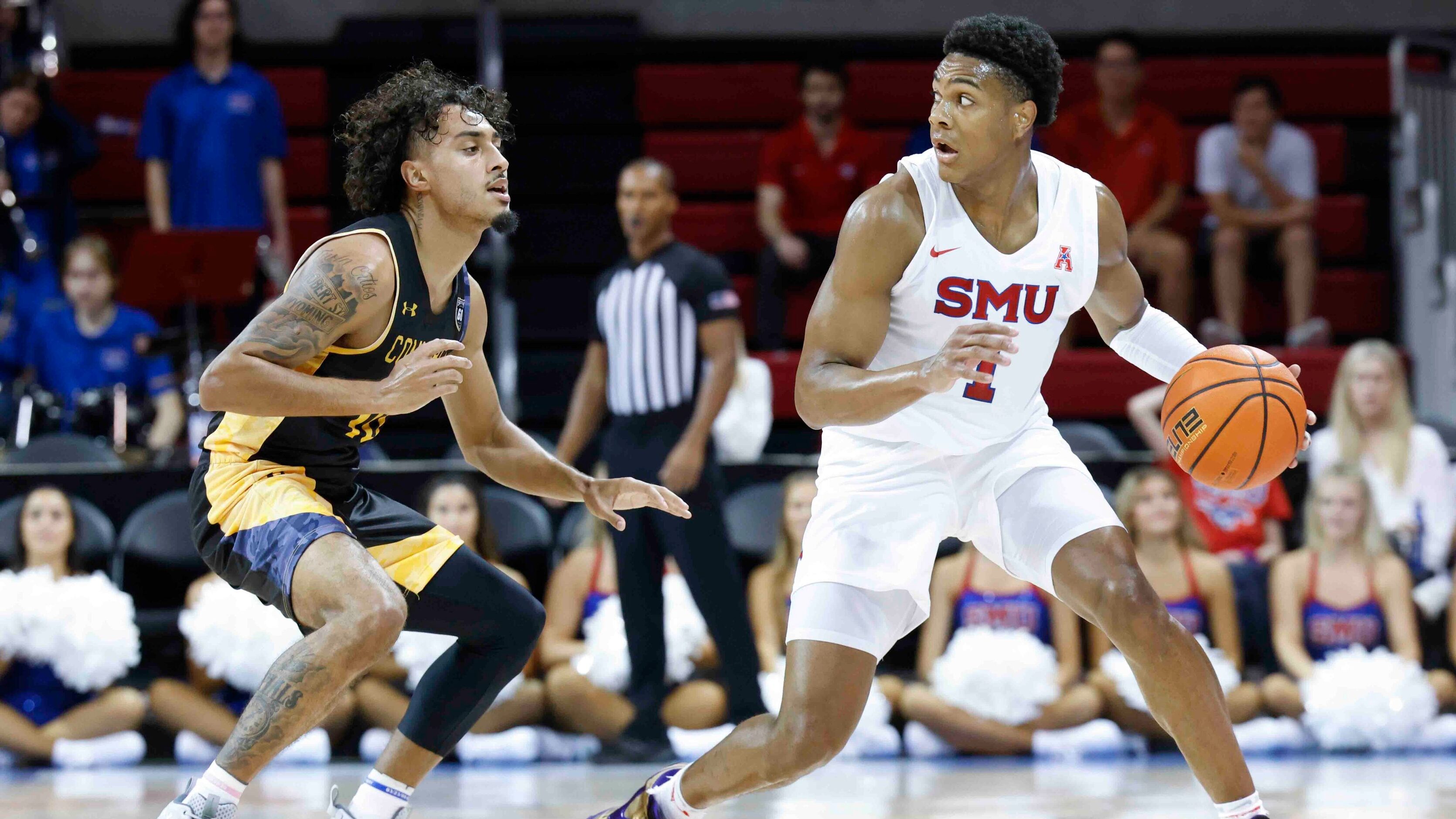 Southern Methodist guard Zhuric Phelps (1), right, looks to pass past Texas A&M-Comm’s...